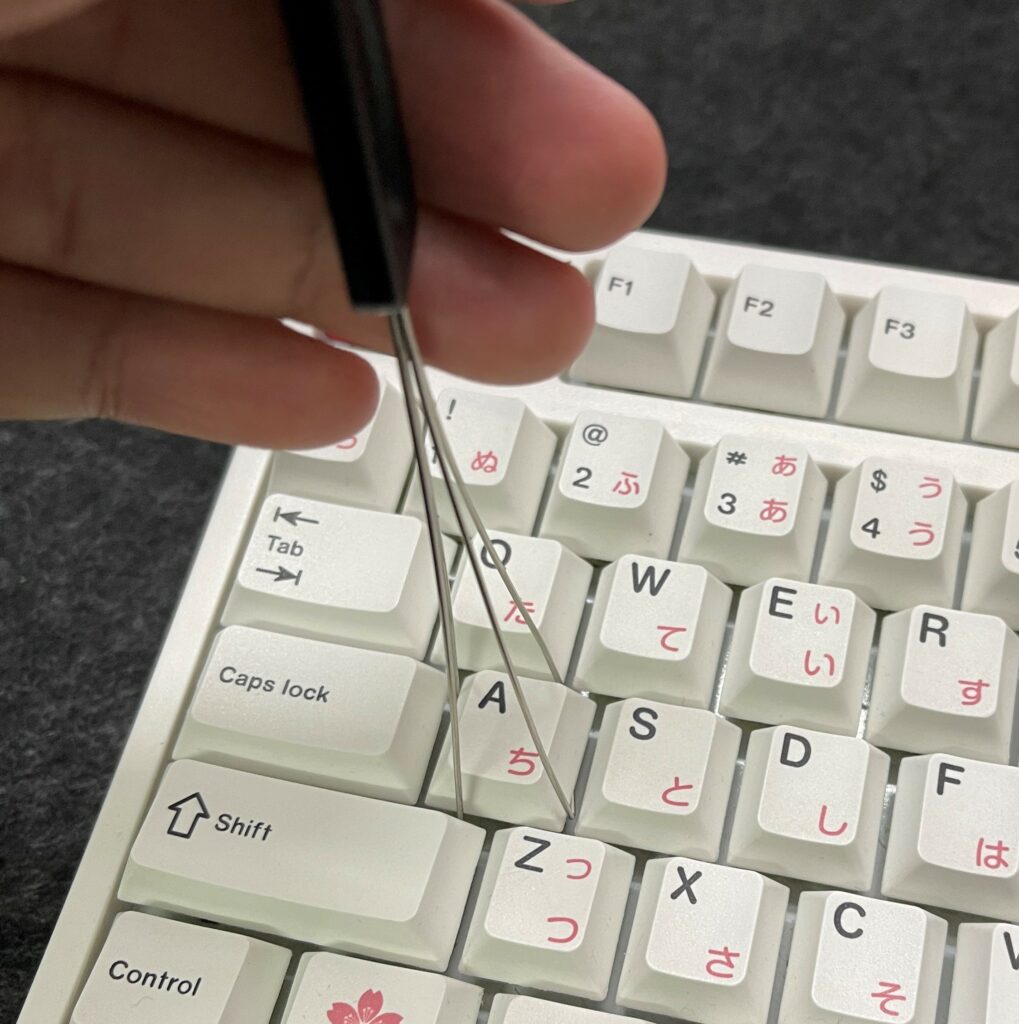 insert keycap puller underneath the key